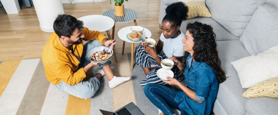 Roommates living in their first college apartment.