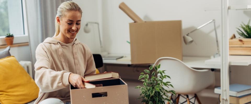 A person moving into their first college apartment.