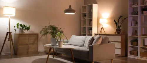 An apartment living room with all lights turned onto illustrate how to save on your light bill.