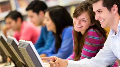 Group of college students in a computer lab - rentcafe apartments near universities