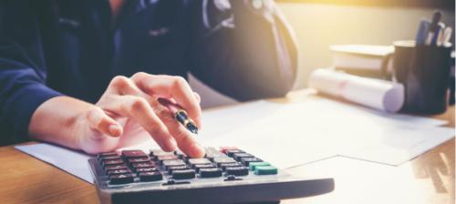 person_calculating_expenses_finance