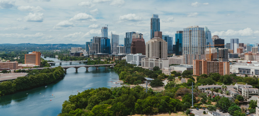 An aerial shot of downtown Austin and the parks that surround the best neighborhoods in the city.