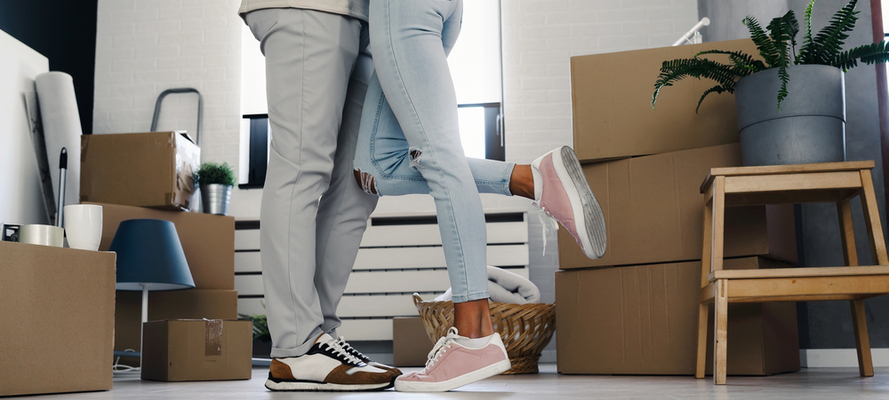 Couple Moving into Home with Boxes