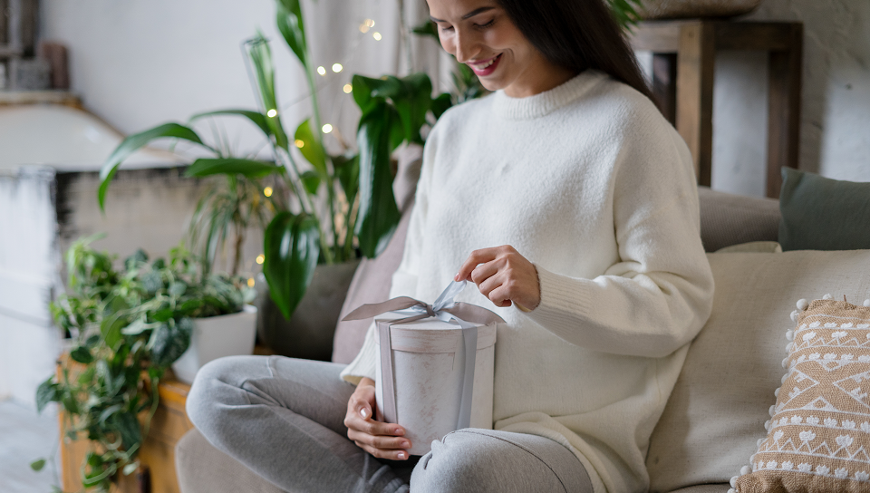 happy woman opening gift