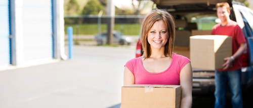 Storage Couple Getting Things Out of a Truck