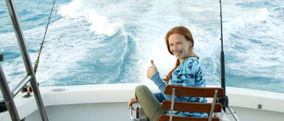 Young woman on a fishing charter boat.