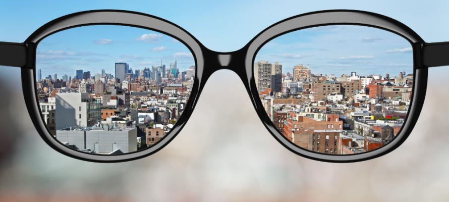 black glasses looking to modern city