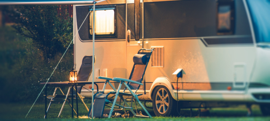 Travel Trailer Caravaning. RV Park Camping at Night.