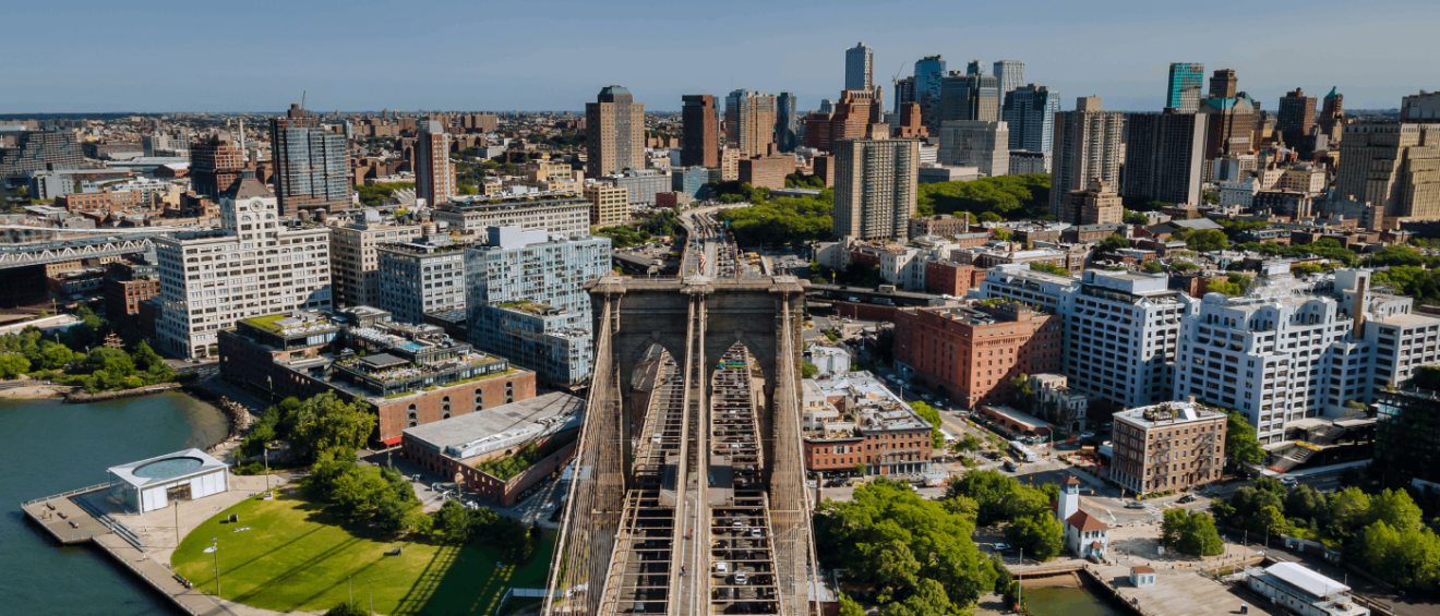 aerial view of brooklyn with numerous sky scrapers in the background