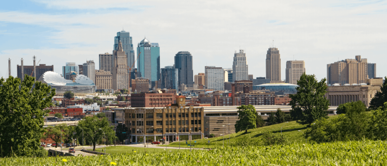 view of downtown Kansas City, Missouri, skyline from a green field