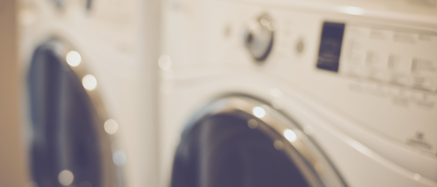 Blurred Laundry Room with Washer and Dryer with Retro Instagram Style Filter