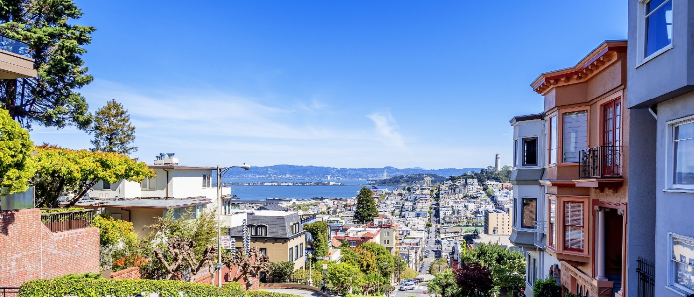 North Beach, Treasure Island, East Bay, Oakland, and Coit Tower photographed from the top of famous Lombard street in the Russian Hill and Nob Hill area of San Francisco, CA.