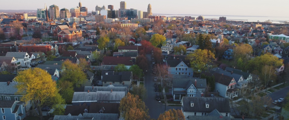 aerial views of houses and sky scrapers in the background in Buffalo, NY