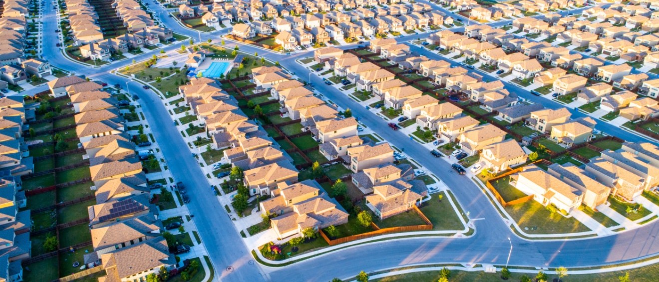 suburban housing in neighborhood of build to rent homes