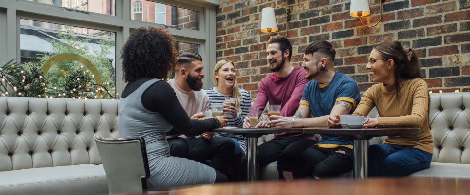 picture of friends hanging in a social lounge