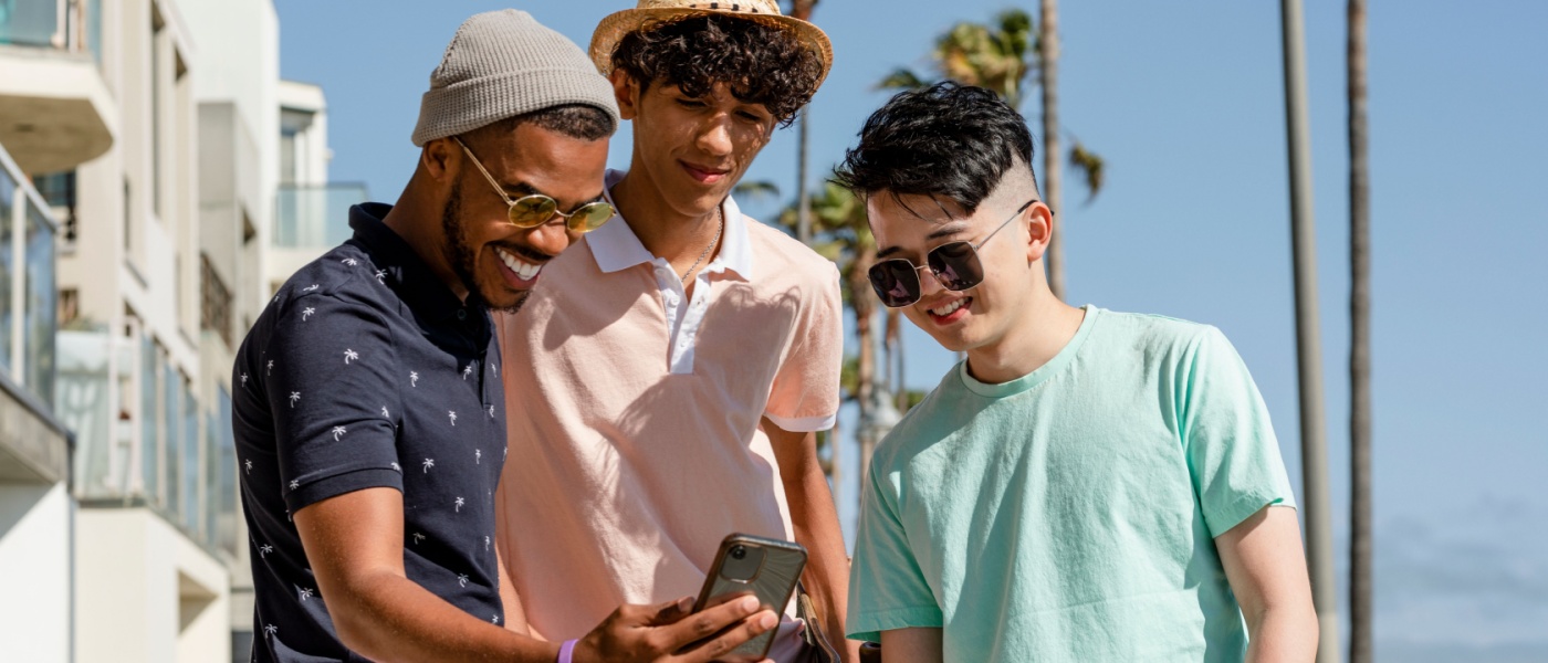 Gen Z roommates watching viral content on social media while enjoying a sunny afternoon in a city in Florida.