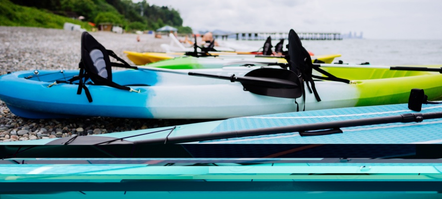 Kayaks and SUP boards on the sea