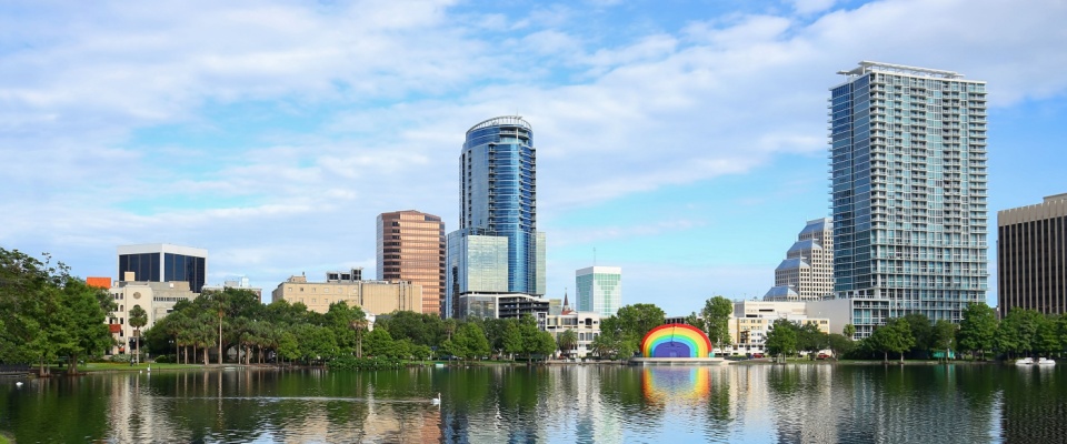 Downtown Orlando's skyline reflects into the glistening waters of Lake Eola.