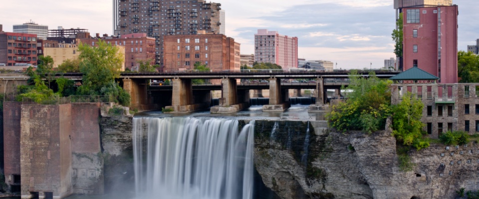 High Waterfalls in the City of Rochester with tall buildings in the background