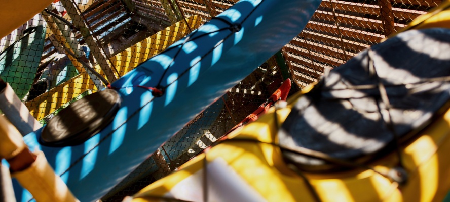 kayaks on shelves in storage