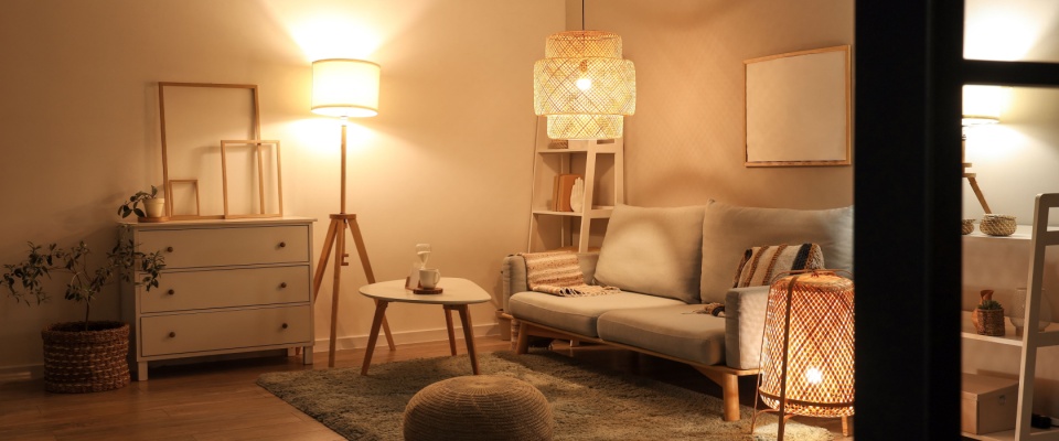 A living room with ambient lighting and a cozy sofa.