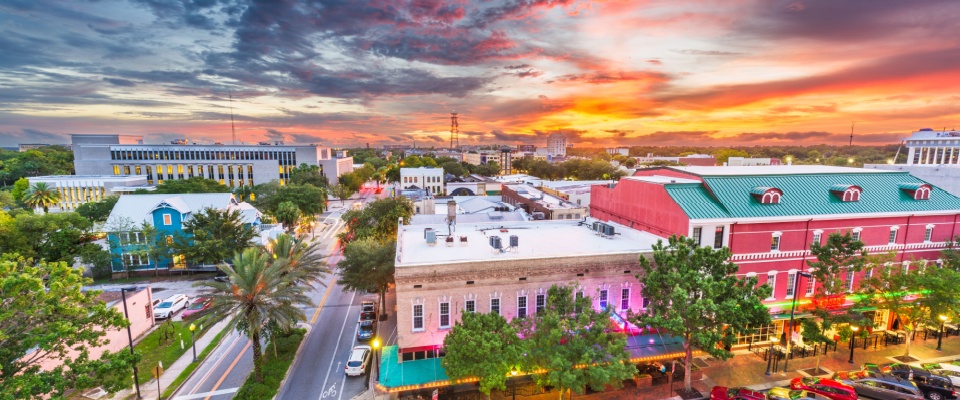 Downtown cityscape at dusk in Gainesville, Florida, where apartment size is largest in the nation.