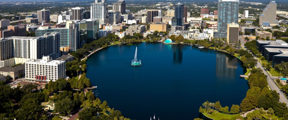 Beautiful view of the watefront and building sin Orlando, Florida, where apartment size is among the largest in the state.