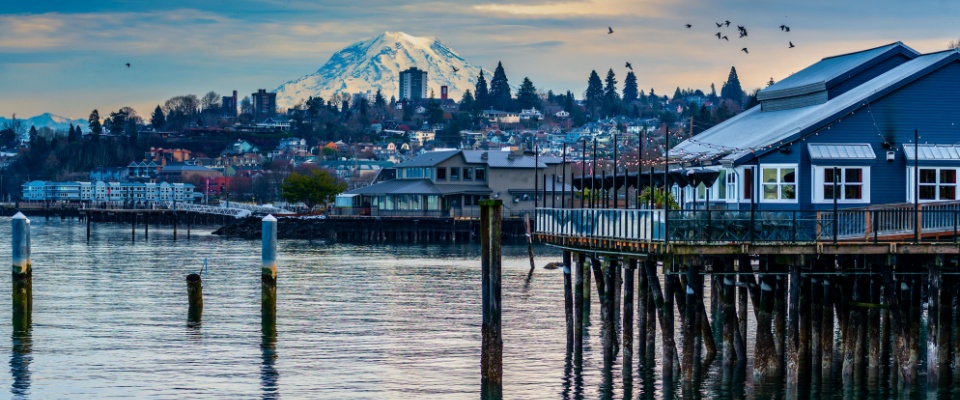 Buildings in Tacoma, WA, with Mount Rainier in the background. Here renters get 727 square feet of apartment space for $1,500.