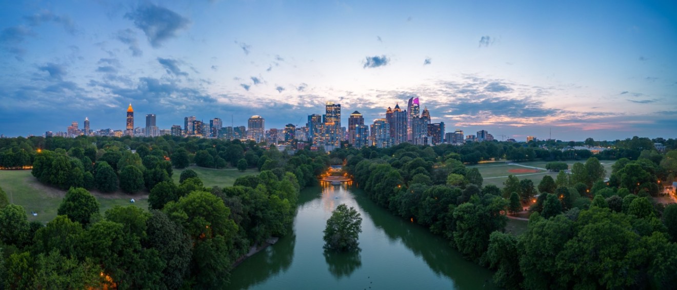 View of Atlanta, GA, overlooking Piedmont Park at dusk.