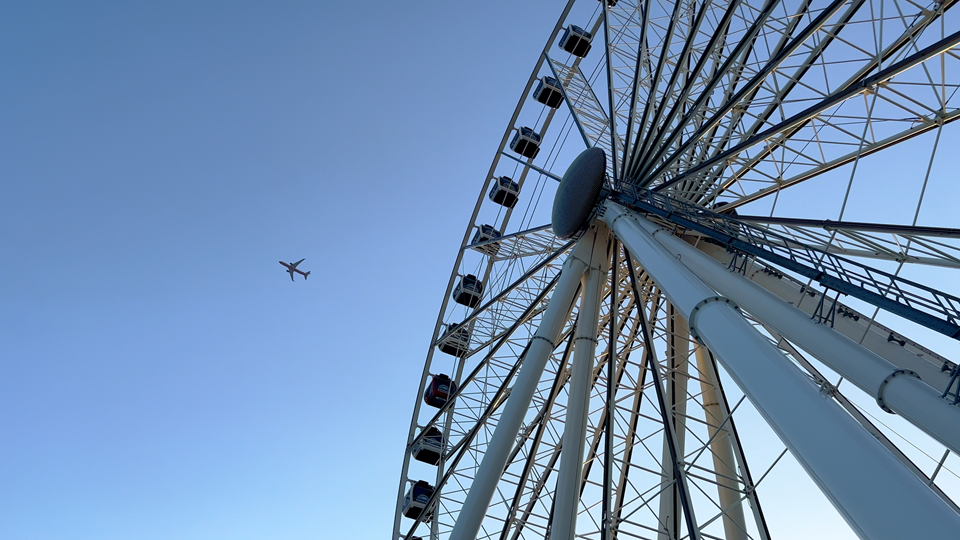 view of miami observation wheel against blue sky