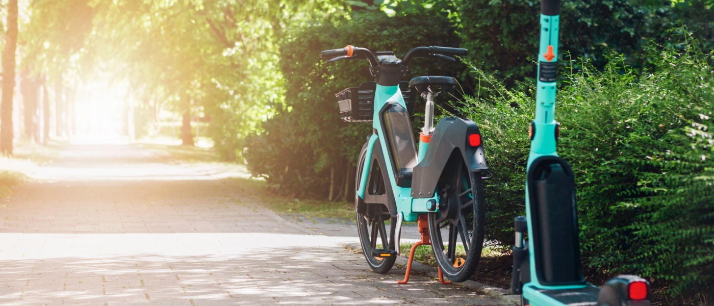 Bike and e-scooter for rent, two transportation alternatives for city renters.