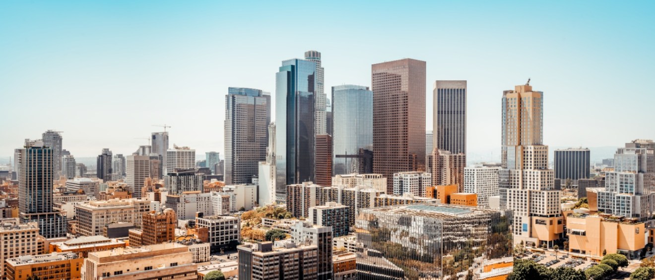 The skyline of Downtown Los Angeles with skyscrapers at the center.