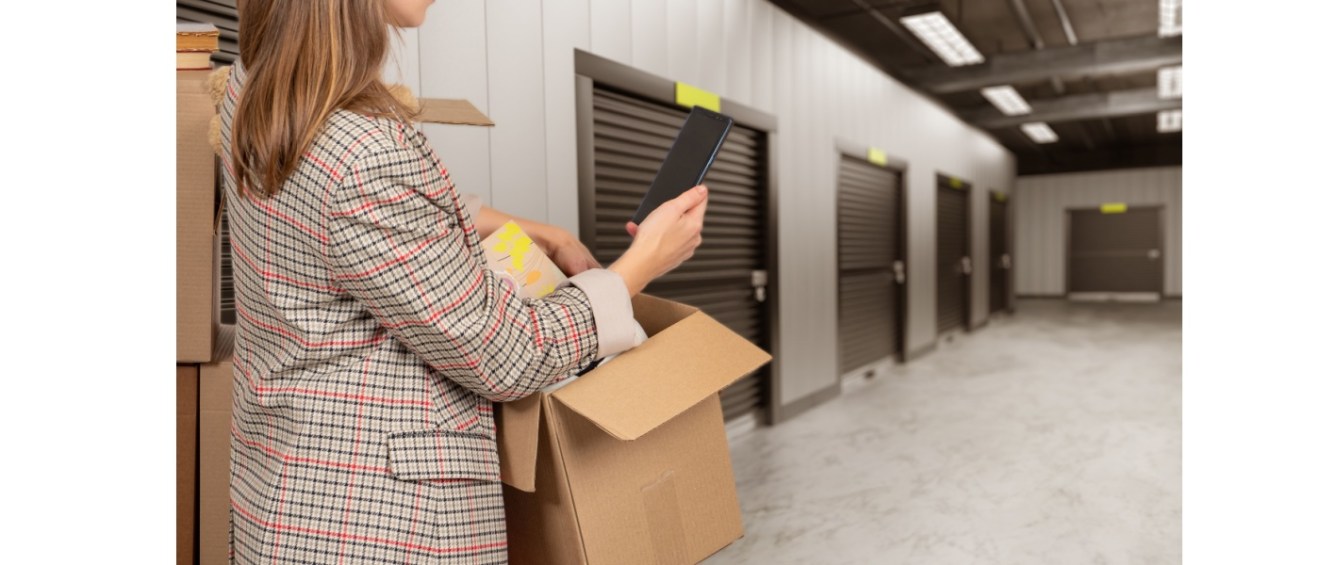 Woman in front of self storage unit