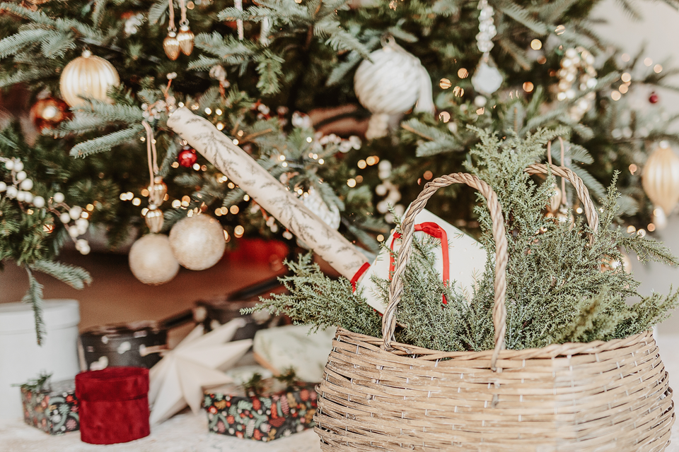 basket with holiday decorations on the floor