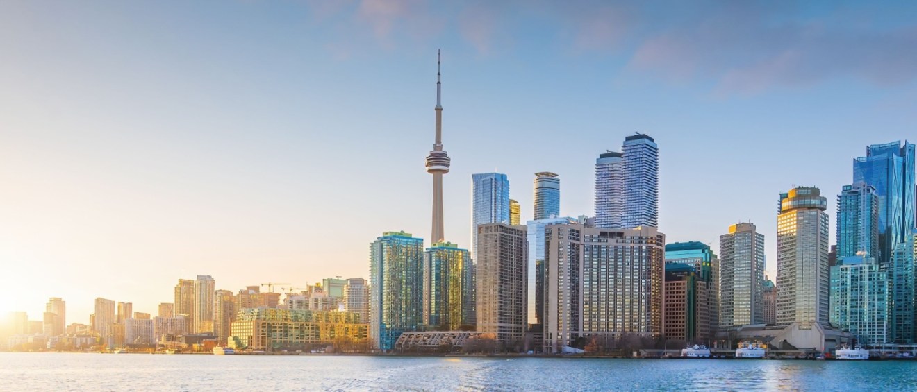 Toronto skyline at sunrise, featuring the iconic CN Tower and modern high-rises, highlighting the city’s status as a major renter hub in Canada.