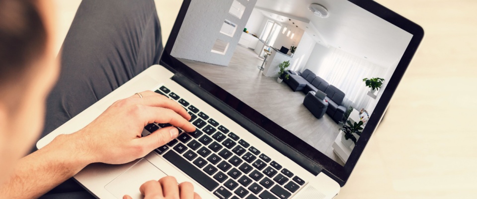 Apartment search online concept: house search application on a laptop screen.