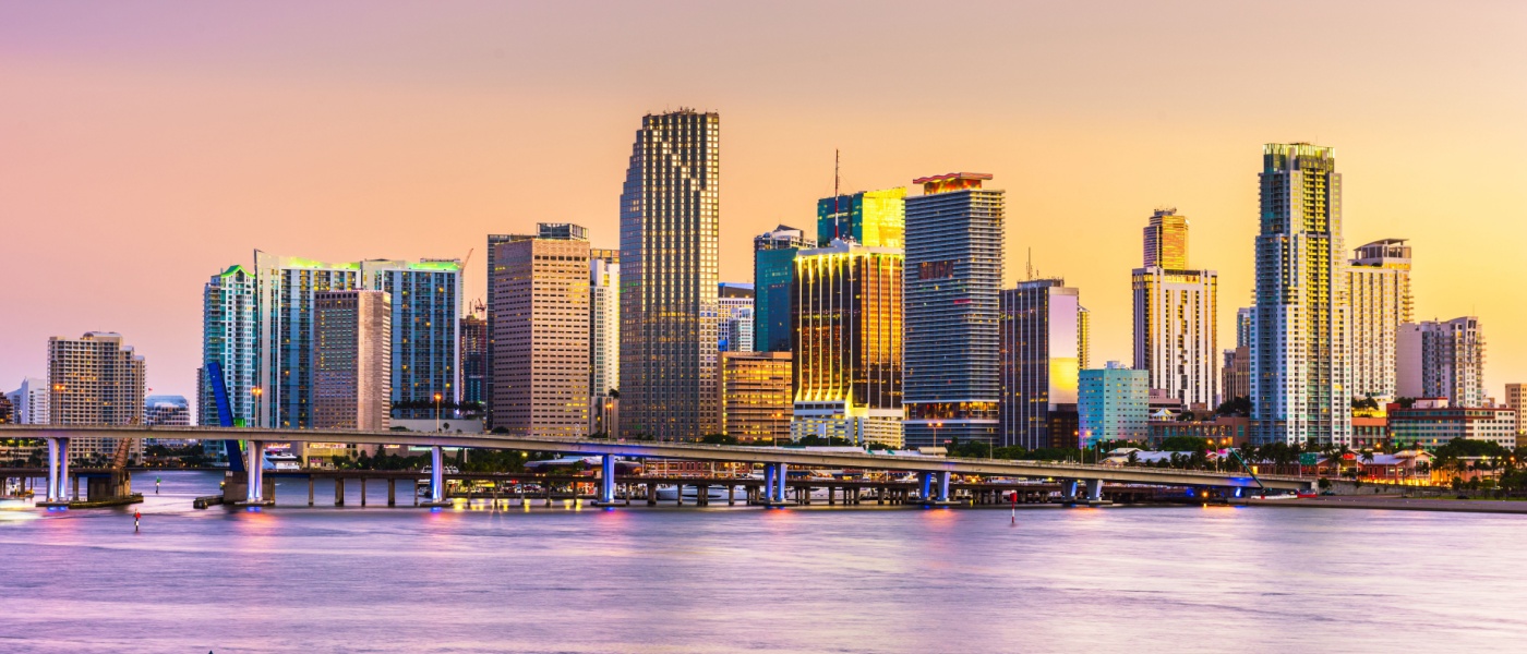 The skyline of Miami, FL, from Biscayne Bay at dusk.