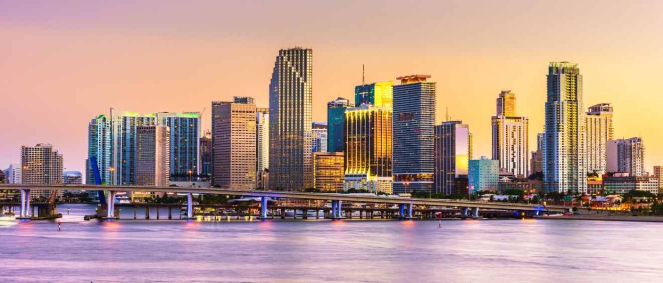 The skyline of Miami, FL, from Biscayne Bay at dusk.