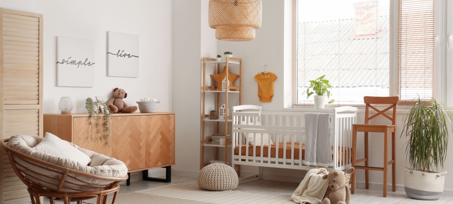 Interior of children's bedroom with wooden cabinet and bed near window