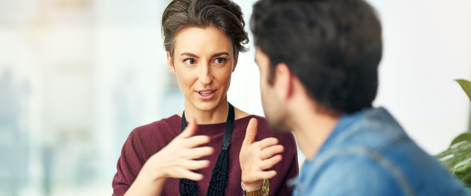 Woman and landlord engaged in a discussion regarding lease terms. 