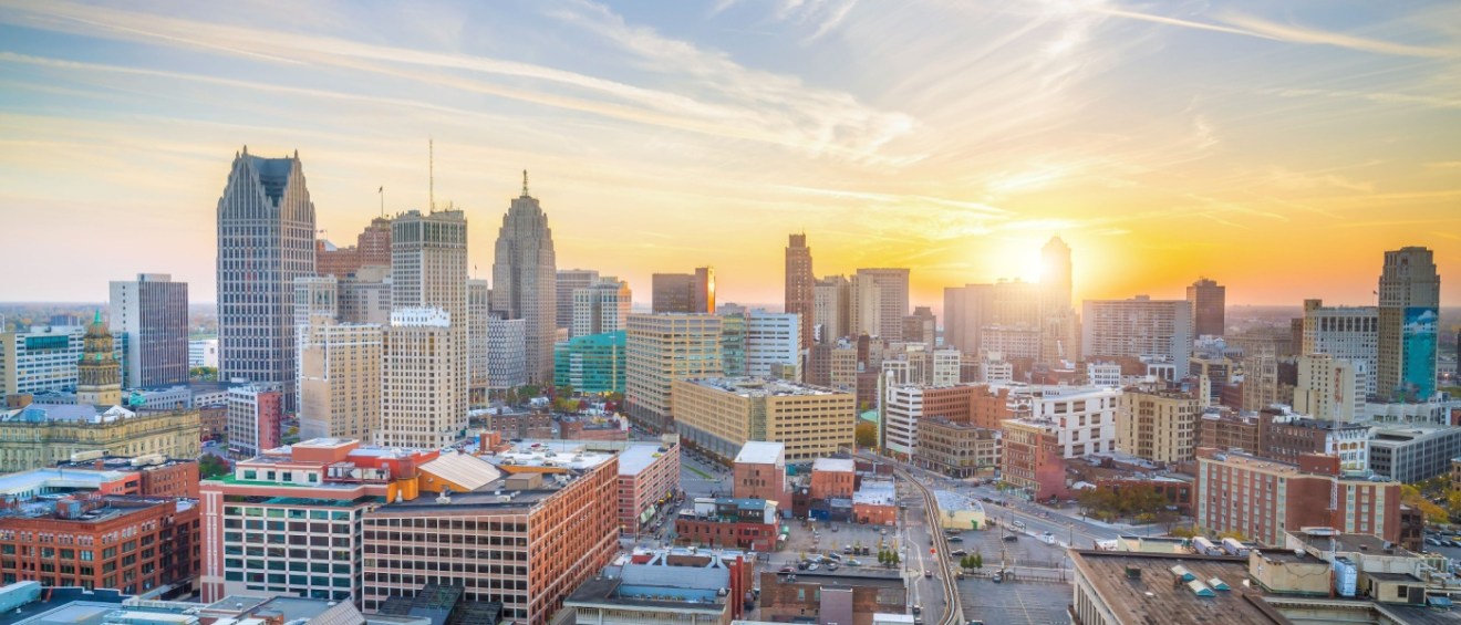 Detroit skyline at sunrise, showcasing a city where renters can still find affordable neighborhoods.