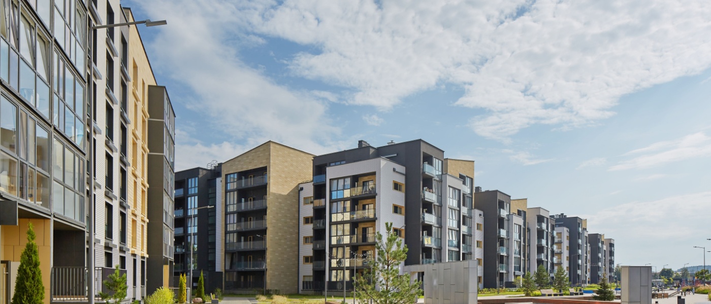 New modern apartment building in a green area.