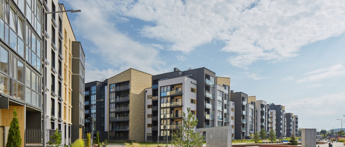 New modern apartment building in a green area.