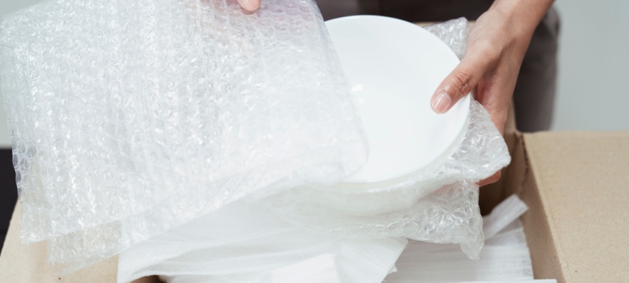 Plates wrapped in bubble wrap.