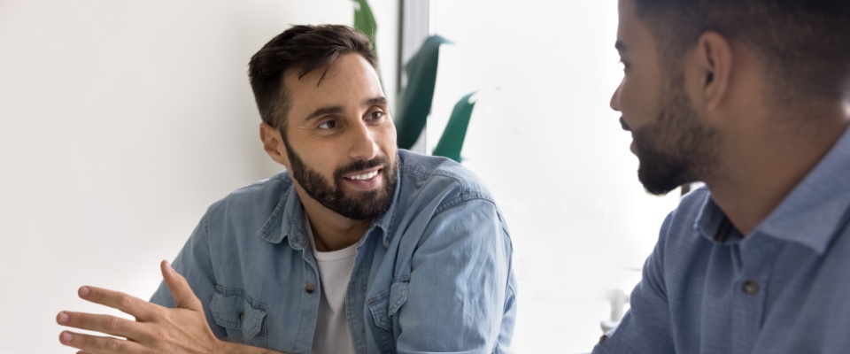 Father talking about rent control with landlord.