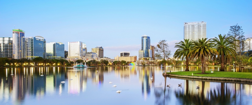 Dusk view of the Orlando skyline across Lake Eola with its fountain, ranked #9 move-easy metro for US renters.