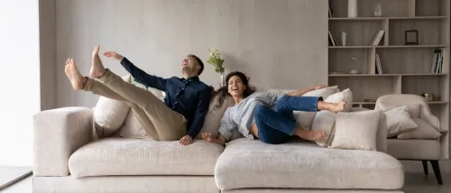 Happy couple celebrates moving into their new rental, highlighting America's move-easy metros.