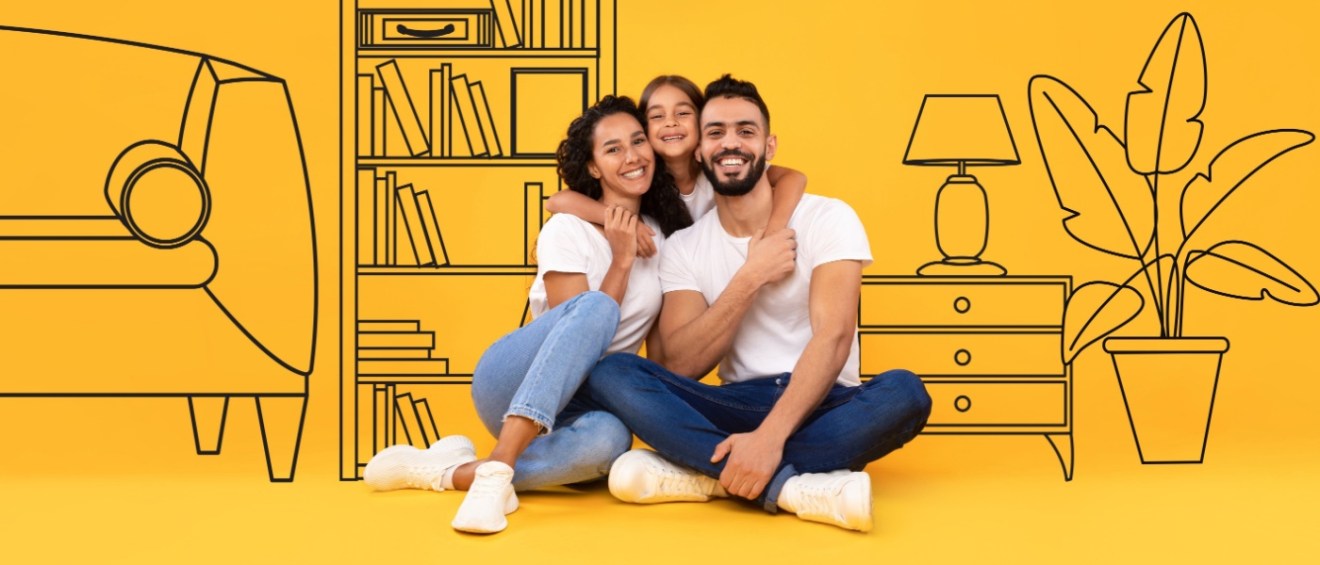 A cheerful man, woman, and young girl embrace and smile while sitting on the floor, visually conveying the happiness of renters benefiting from apartment specials.