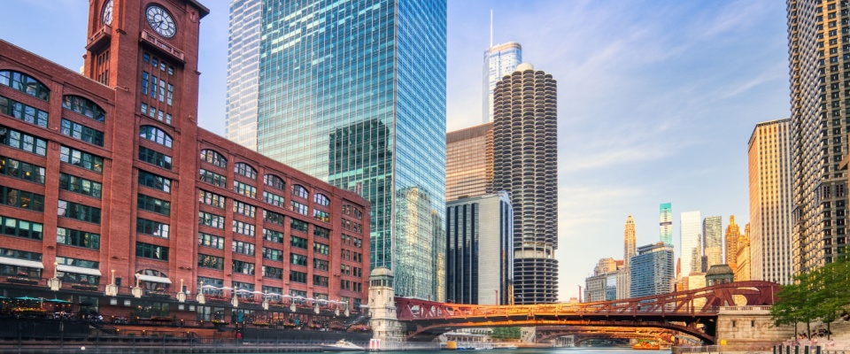 Chicago Downtown cityscape with the Chicago River at sunset, showcasing stunning urban views and the desirable lifestyle offered by apartments in Chicago.