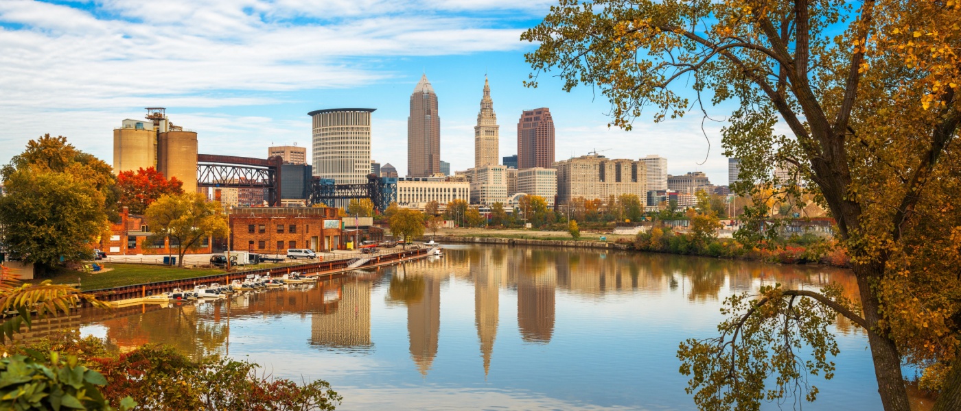 Cleveland skyline along the Cuyahoga River in autumn—highlighting the city's seasonal beauty and offering insight into the cost of living in this vibrant urban area.